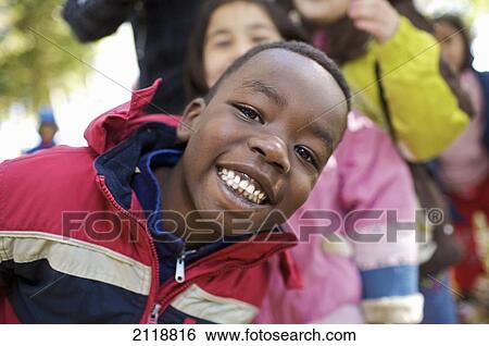 Stock Photograph - Multi-Ethnic New Canadian Children Playing Outside Esl School; Guelph Ontario Canada. Fotosearch