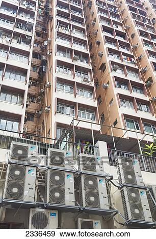 Multi-Storey Apartment Block Near Bowrington Road Market With Many Air Conditioners; Hong Kong, China View Large Photo Image Stock Photo - Multi-Storey Apartment Block Near Bowrington Road Market With Many Air Conditioners; Hong Kong, China. Fotosearch