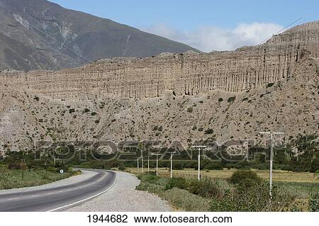 Stock Image - Multicolored mountains of the Quebrada de Humahuaca between the towns of Tilcara and Hornillos, Jujuy, Argentina. Fotosearch