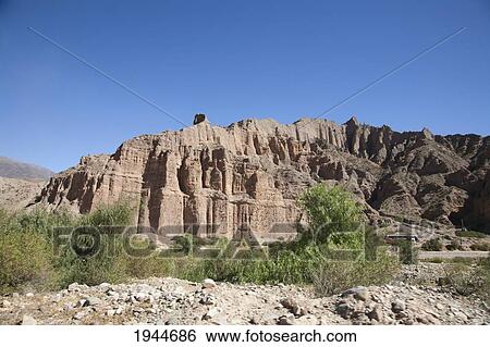 Stock Photograph - Multicolored mountains of the Quebrada de Humahuaca between the towns of Tilcara and Hornillos, Jujuy, Argentina. Fotosearch