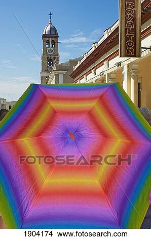 Picture - Multicolored Umbrella In Front Of Cathedral Of Santisimo Salvador, Bayamo, Granma Province, Cuba. Fotosearch