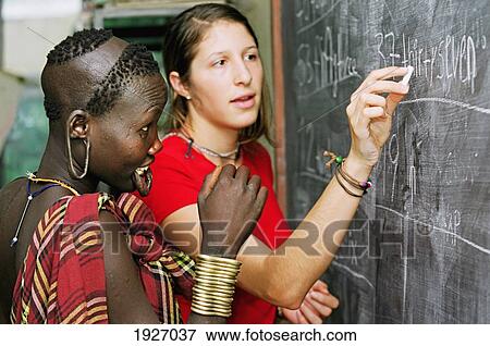 Stock Photo - Mursi Tribal Girl With Ear Lobes And Lower Lip Pierced During English Lesson Ran By Christian Missionaries. Fotosearch