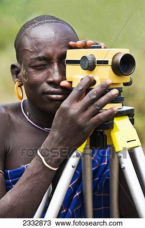 Stock Image - Mursi Warrior; Dirikoro, Ethiopia. Fotosearch
