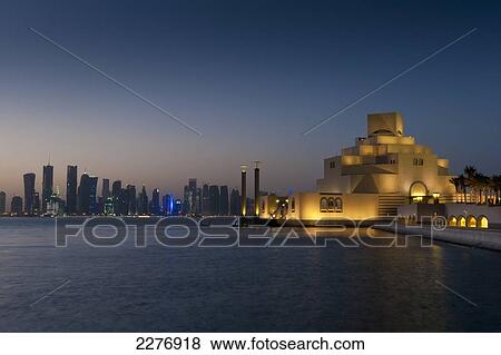 Museum of Islamic Art at dusk with modern city skyline behind; Doha, Qatar View Large Photo Image Stock Photo - Museum of Islamic Art at dusk with modern city skyline behind; Doha, Qatar. Fotosearch