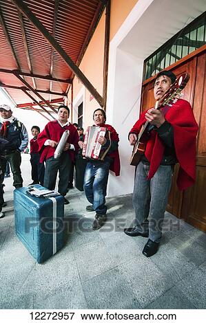 Stock Photo - Musical ensemble playing at the railway station, Guamote, Chimborazo, Ecuador. Fotosearch
