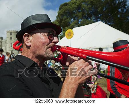 Stock Image - Musician at music festival; Dorset, England. Fotosearch