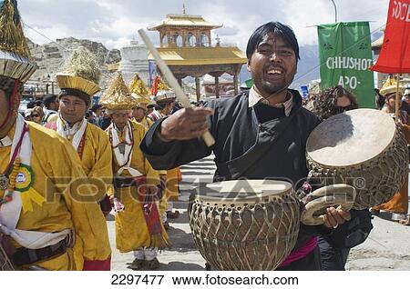 Stock Photo - Musician playing Daman (drums) during the opening parade of the Festival of Ladakh. The Festival Ladakh is held every year in the first two weeks of September and celebrates local culture through dance and sport. Ladakh, Province of Jammu and Kashmir, I. Fotosearch