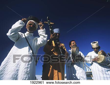 Stock Image - Musicians Busking For Money. Fotosearch