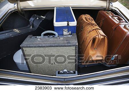 Stock Image - Musician's luggage in a car with an open trunk; Langley, British Columbia, Canada. Fotosearch
