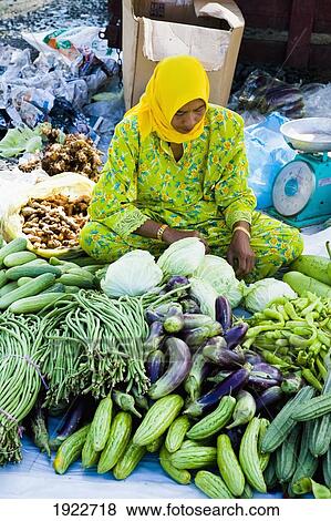 Stock Photo - Muslim Woman Selling Vegetables. Fotosearch