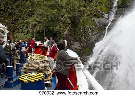 Mv Skorpios Next To A Waterfall In Quitralco Fjord, Aysen Region, Chile View Large Photo Image Stock Image - Mv Skorpios Next To A Waterfall In Quitralco Fjord, Aysen Region, Chile. Fotosearch