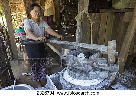 Picture - Myanmar (Burma), Irrawaddyi division, Woman making rice noodle; Yea Thoe village. Fotosearch