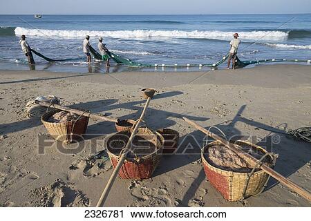 Stock Image - Myanmar (Burma), Irrawaddyi division, Fishing of small prawn with nets. Fotosearch