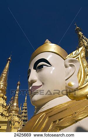 Stock Photo - Myanmar (Burma), Yangon (Rangoon), Shwedagon Paya, a nat (or spirit) statue. Fotosearch