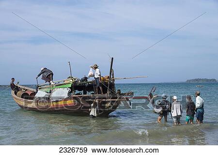 Stock Photo - Myanmar, Irrawaddyi division, Passengers boarding public boat; Nwe Saung. Fotosearch