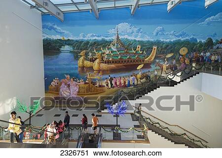 Stock Image - Myanmar, Lobby with fresco in Yangon international airport; Yangon. Fotosearch