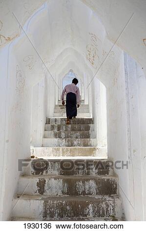 Stock Photograph - Myanmar, Upper Burma, Man Walking up Arched Stairway; Mingun. Fotosearch