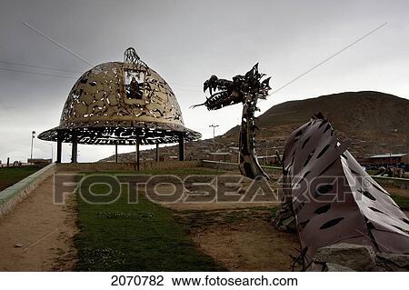 Stock Image - Mythological Snake And Miner's Hat-Shaped Modern Monuments At The Entrance To Oruro, Bolivia. Fotosearch