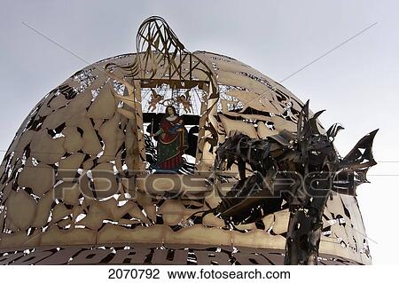 Stock Image - Mythological Snake And Miner's Hat-Shaped Modern Monuments At The Entrance To Oruro, Bolivia. Fotosearch