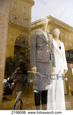 Stock Photo - Naki Kouyioumtzis/ Axion Milan, Italy. People Out Shopping/ Reflections In Windows. Fotosearch