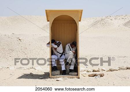 Stock Image - Napping Security Guards, Saqqara, Al Jizah, Egypt. Fotosearch