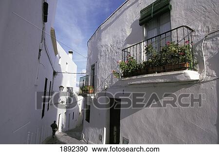 Stock Image - Narrow Alley Between Houses. Fotosearch