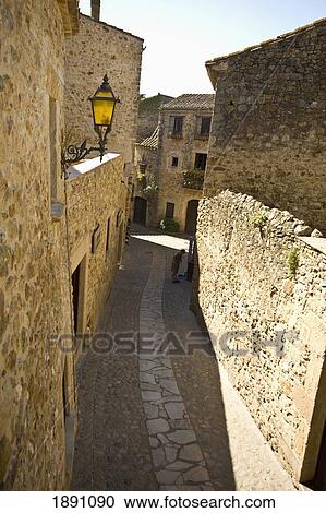 Stock Image - Narrow Street In Medieval Village. Fotosearch