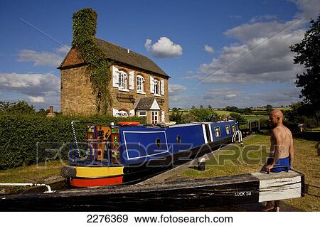 Narrowboat on Oxfordshire Canal, Somerton Deep Lock; Somerton, Somerset, England View Large Photo Image Stock Photo - Narrowboat on Oxfordshire Canal, Somerton Deep Lock; Somerton, Somerset, England. Fotosearch