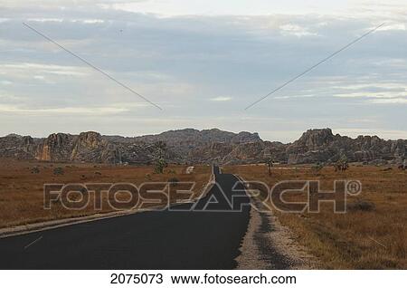 National Highway No. 1 & Eroded Jurassic Sandstone Massive Near La Fenetre Rock Formation, Isalo National Park, Fianarantsoa Province, Madagascar View Large Photo Image Stock Image - National Highway No. 1 & Eroded Jurassic Sandstone Massive Near La Fenetre Rock Formation, Isalo National Park, Fianarantsoa Province, Madagascar. Fotosearch