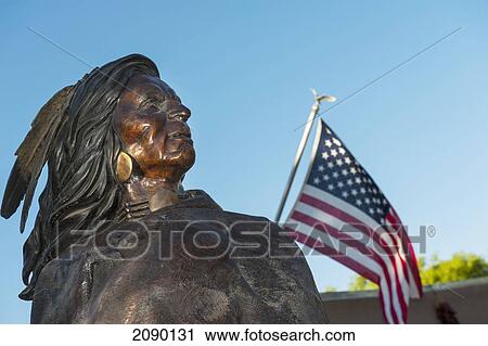 Native American Indian Bronze Statue Next To An American Flag At Friday Night Canyon Road Gallery Walk In Santa Fe, New Mexico, Usa View Large Photo Image Stock Image - Native American Indian Bronze Statue Next To An American Flag At Friday Night Canyon Road Gallery Walk In Santa Fe, New Mexico, Usa. Fotosearch