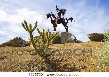 Stock Image - Native American statue in Nk'Mip Desert Culture Centre; Osoyoos, British Columbia, Canada. Fotosearch