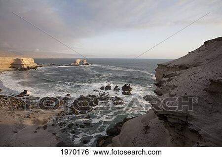 Natural Monument Of La Portada De Antofagasta, As Seen From The Surrounding Sandstone Cliffs, Antofagasta Region, Chile View Large Photo Image Stock Photograph - Natural Monument Of La Portada De Antofagasta, As Seen From The Surrounding Sandstone Cliffs, Antofagasta Region, Chile. Fotosearch