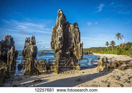 Stock Image - Nauru's rocky coastline; Nauru. Fotosearch