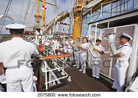 Stock Image - Navy Band Performing On Board Of The Four-Mast Barquentine, Chilean Navy Training Ship Esmeralda In Hanga Roa Harbour, Rapa Nui (Easter Island), Chile. Fotosearch