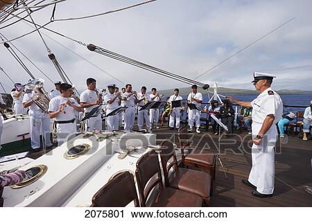 Stock Image - Navy Band Performing On Board Of The Four-Mast Barquentine, Chilean Navy Training Ship Esmeralda In Hanga Roa Harbour, Rapa Nui (Easter Island), Chile. Fotosearch