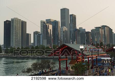 Navy Pier And Skyscrapers Along The Water; Chicago Illinois United States Of America View Large Photo Image Stock Photo - Navy Pier And Skyscrapers Along The Water; Chicago Illinois United States Of America. Fotosearch