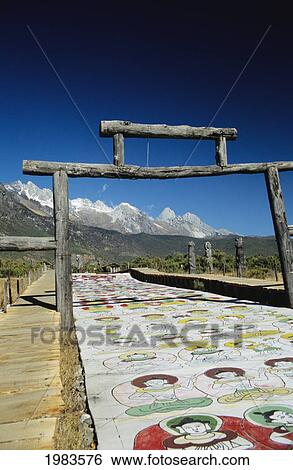 Stock Photograph - Naxi Ceremonial Walkway and totems near Lijiang; China. Fotosearch