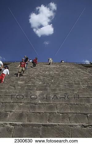 Stock Image - Near Mexico City; Mexico, Teotihuacan Archeological Site, Feathered Serpent Pyramid. Fotosearch