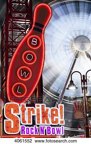 Stock Image - Neon lights and bowling sign in the entertainment district; Niagara Falls, Ontario, Canada. Fotosearch