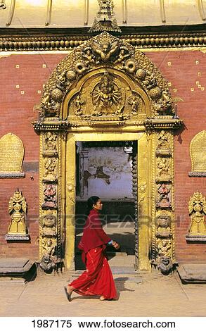 Nepal, Bhaktapur, Durbar Square, Local Woman Walking Past Golden Gate, Afternoon Lighting. View Large Photo Image Stock Photography - Nepal, Bhaktapur, Durbar Square, Local Woman Walking Past Golden Gate, Afternoon Lighting.. Fotosearch