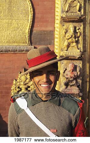 Stock Photo - Nepal, Bhaktapur, Durbar Square, Headshot Of Smiling Nepalese Guard, Afternoon Lighting.. Fotosearch