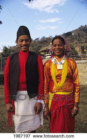 Stock Photo - Nepal, Gorkha, Smiling Young Couple Dressed For Festival In Colorful Clothing. Editorial Use Only.. Fotosearch