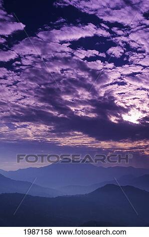 Stock Photo - Nepal, Himalayan in distance at sunset; Near Gorkha. Fotosearch