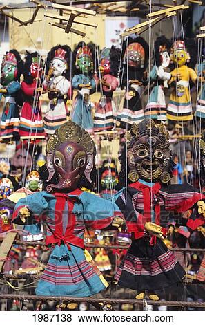 Nepal, Kathmandu, Close-Up Of Colorful Traditional Puppets Hanging On Display. View Large Photo Image Stock Photo - Nepal, Kathmandu, Close-Up Of Colorful Traditional Puppets Hanging On Display.. Fotosearch
