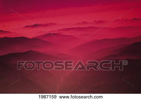 Nepal, Kathmandu Valley, River Flowing Between Mountains At Sunset, Red Foggy Glow. View Large Photo Image Stock Photo - Nepal, Kathmandu Valley, River Flowing Between Mountains At Sunset, Red Foggy Glow.. Fotosearch