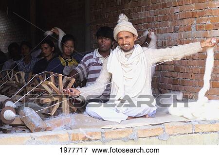 Stock Photo - Nepal, Kathmandu, Workers Refining Wool For Rugs.. Fotosearch
