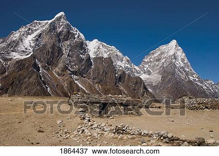 Stock Photo - Nepal's Taboche Peak, Cholatse And Arakam Tse, With Farm House In The Foreground; Khumbu Region, Nepal. Fotosearch