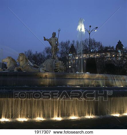 Neptune Fountain And Ritz Hotel Illuminated At Dusk View Large Photo Image Stock Photo - Neptune Fountain And Ritz Hotel Illuminated At Dusk. Fotosearch