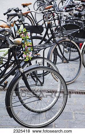 Stock Photo - Netherlands, Zealand, Bicycles parked in row; Goes. Fotosearch