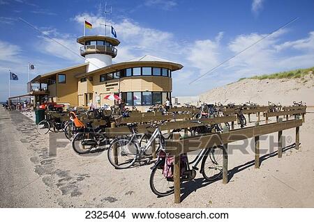 Netherlands, Zealand, Bikes parked and locked along wooden posts and beams at beach; Vlissingen View Large Photo Image Picture - Netherlands, Zealand, Bikes parked and locked along wooden posts and beams at beach; Vlissingen. Fotosearch